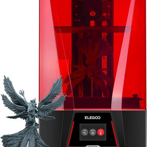 May include: A red 3D printer with a clear plastic enclosure. The printer has a black base with a silver trim and a control panel with buttons for "Tool", "System", and "Print". The printer is printing a gray figurine of a winged creature. The text "ELEGOO" is printed on the front of the printer.
