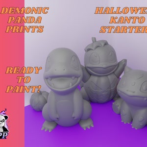 May include: Three gray 3D printed Halloween-themed Pokemon figures: Bulbasaur, Charmander, and Squirtle. The figures are ready to be painted. The text "DEMONIC PANDA PRINTS" and "READY TO PAINT!" is visible in the image. The text "HALLOWEEN KANTO STARTERS" is also visible in the image.
