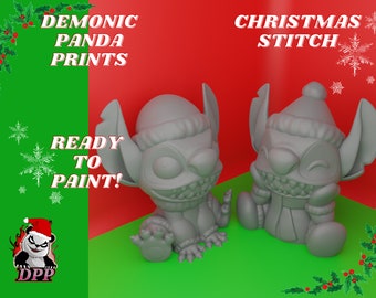 May include: Two gray, unpainted, Christmas Stitch figurines with Santa hats. The figurines are ready to be painted. The text "Christmas Stitch" is in the upper right corner of the image. The text "Demonic Panda Prints" is in the upper left corner of the image. The text "Ready to Paint!" is in the center of the image.