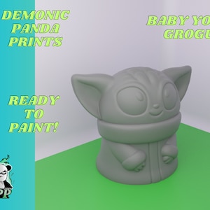 May include: Unpainted gray plastic figurine of Baby Yoda, also known as Grogu, from the Star Wars series The Mandalorian. The figurine is ready to be painted. The text "BABY YODA GROGU" is written in green letters on a white background.