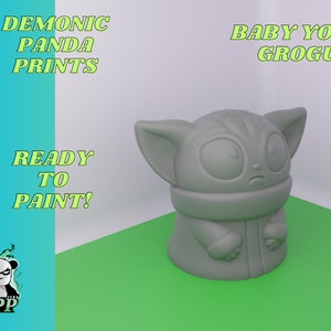 May include: A gray 3D printed figurine of Baby Yoda, also known as Grogu, from the Star Wars series The Mandalorian. The figurine is ready to be painted. The text "BABY YODA GROGU" is written above the figurine.