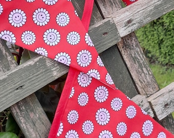 Smiley faces in a flower head, theme fabric bunting - red background, double sided with star pattern, garden/home decorations, wall hangings