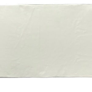 May include: A plain white rectangular fabric tablecloth.
