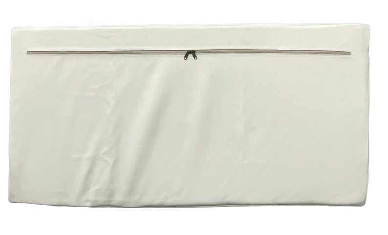 May include: A white zippered mattress cover with a beige zipper.