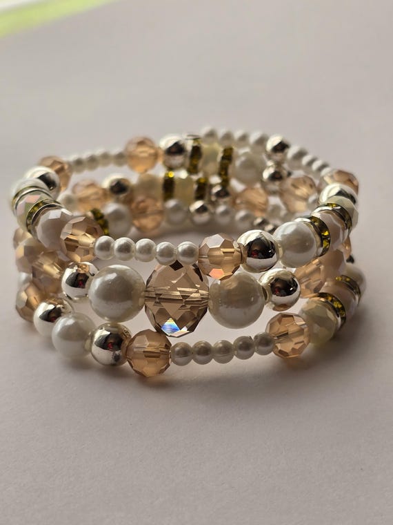 light pink and light yellow memory wire bracelet.