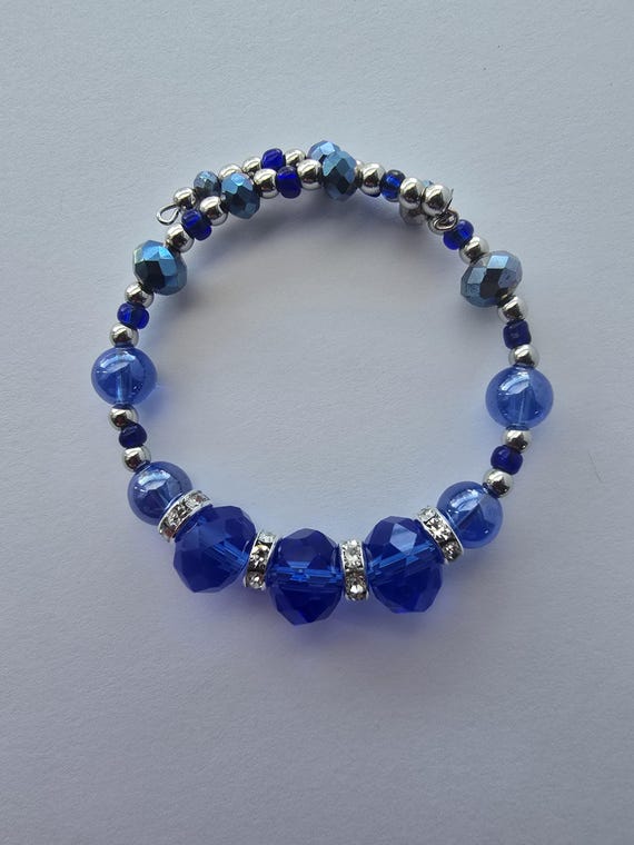 Sapphire blue and silver beads memory wire bracelet.