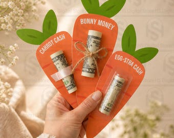 May include: Three orange carrot-shaped gift card holders with green leaf accents. Each holder has a rolled-up dollar bill. Text on the cards reads "CARROT CASH", "BUNNY MONEY", and "EGG-STRA CASH".