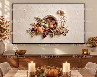 May include: A rectangular wall art piece featuring a textured cream-colored background with a central relief sculpture of a cornucopia overflowing with various fruits, including grapes, pears, and pumpkins, framed in a thin black border.