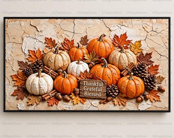 May include: A rectangular wall art print featuring orange and white pumpkins, brown autumn leaves, pinecones, and cinnamon sticks on a cracked beige background. A wooden sign in the center displays the text Thankful Grateful Blessed.