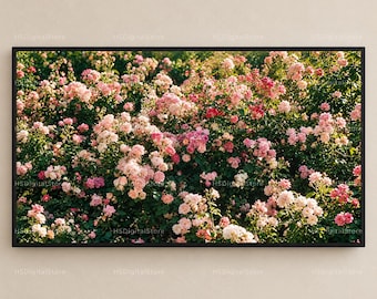 Peut inclure: Une œuvre d'art murale rectangulaire horizontale représentant un jardin dense de roses en fleurs dans des tons de rose clair, blanc doux et magenta profond, sur un feuillage vert foncé, le tout encadré d'un fin cadre noir.