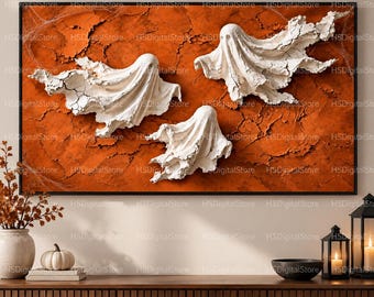 May include: A rectangular wall art piece featuring three white, textured ghost figures floating against a vibrant, cracked orange background. The ghosts have flowing, draped forms with detailed, uneven edges, creating a dimensional appearance.