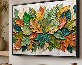 Peut inclure: Une œuvre d'art murale rectangulaire présentant un arrangement dense et texturé de feuilles superposées dans des tons de vert, orange, jaune et crème. L'œuvre présente une application de peinture épaisse et est encadrée d'un cadre noir fin.