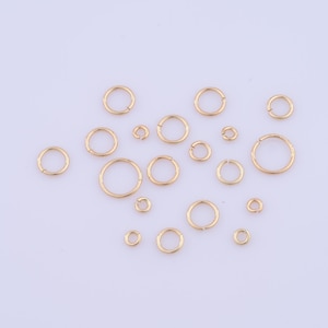 May include: Assortment of gold jump rings in various sizes. These rings are perfect for jewelry making, crafting, and DIY projects.