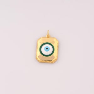 May include: Gold pendant with a blue and green evil eye charm. The charm is in a square shape with a gold border.