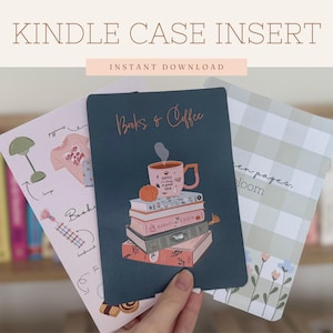May include: Kindle case inserts with different designs. One insert shows a stack of books with a coffee cup, pumpkin, and the text "Books & Coffee." Other inserts have illustrations of a lamp, sweater, and floral patterns.