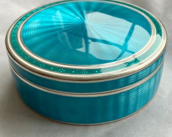 A beautiful and very large heavy sterling silver and gullloche enamel box.