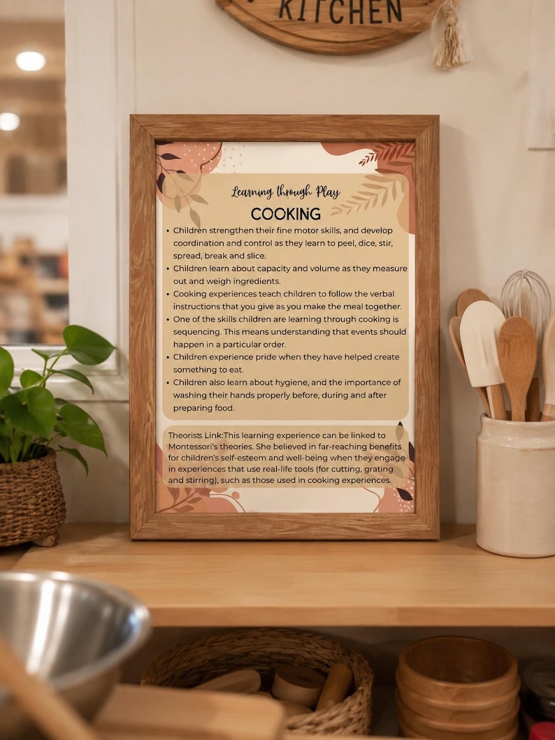 May include: A framed educational poster titled Learning through Play COOKING, featuring text about children developing motor skills, coordination, and sequencing through cooking, with abstract botanical illustrations in shades of brown and beige.