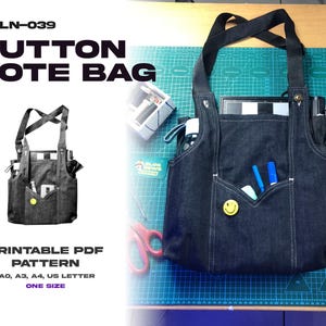 May include: A dark denim button tote bag with black straps, a front pocket, and a yellow smiley face button. The bag contains pens, a tablet, and other items. Text on the image reads "BUTTON TOTE BAG" and "PRINTABLE PDF PATTERN".