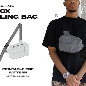 May include: A printable PDF pattern for a box sling bag. The pattern is available in letter, A4, A3, and A0 sizes. The image shows a black and white line drawing of the bag and a person wearing the bag.