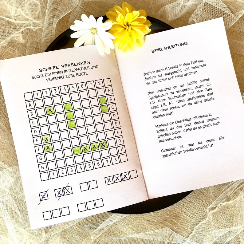 May include: A printable game board for the game Battleship. The board is divided into a grid of 8x8 squares. The squares are labeled with letters A through H and numbers 1 through 8. The game board is printed on white paper with black lines. The game board is designed for two players.