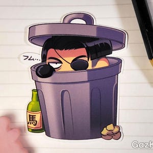 May include: A sticker of a cartoon character with black hair and an eyepatch, wearing a gray trash can on their head. The character is holding a bottle of alcohol and the text "フム..." is in a speech bubble above the character.