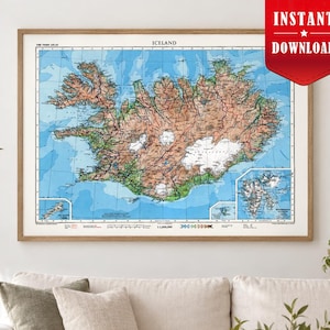 May include: A framed wall map of Iceland featuring a detailed topographical layout with brown terrain, white glaciers, and blue ocean waters. The map includes a scale, legend, and inset maps of surrounding regions, all presented in a horizontal orientation.
