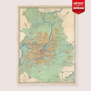 May include: Vintage map print of a city, framed in a light wood. The map features a detailed layout with a river running through the center, surrounded by green and tan areas. The text "INSTANT DOWNLOAD" is in a red banner in the upper right corner.