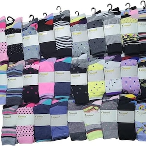 May include: A collection of 36 pairs of colourful socks with various patterns, including polka dots, stripes, and floral designs. The socks are packaged in pairs and labelled "Casual Socks".