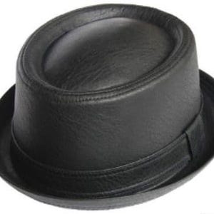 May include: A black leather pork pie hat. The hat has a rounded crown and a flat brim. It features a band around the crown and a slightly upturned brim. A classic hat style, suitable for various occasions.