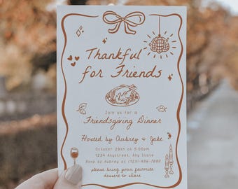 May include: A cream-colored invitation with brown decorative elements and text. The invitation reads "Thankful for Friends" and includes illustrations of a turkey, disco ball, and wine glass. The invitation is for a Friendsgiving Dinner.