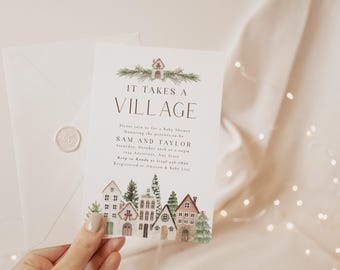 Könnte beinhalten: Eine Babyparty-Einladung mit dem Text "IT TAKES A VILLAGE". Die Einladung zeigt Aquarellillustrationen von Häusern und Bäumen am unteren Rand und einen passenden Umschlag mit einem Wachssiegel.
