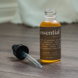 The Essential Serum – a blend of essential oils and organic botanicals made to enrich and vitalize your skin and hair