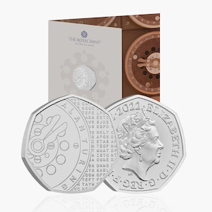 May include: A silver commemorative coin featuring a portrait of Queen Elizabeth II on one side and a design commemorating Alan Turing on the other side. The coin is part of the 2022 British 50 pence coin series.