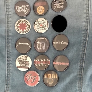 May include: A denim jacket with a variety of band pins, including Violent Femmes, Red Hot Chili Peppers, Metallica, Stone Temple Pilots, Alice in Chains, Social Distortion, Iron Maiden, Nirvana, and Foo Fighters.