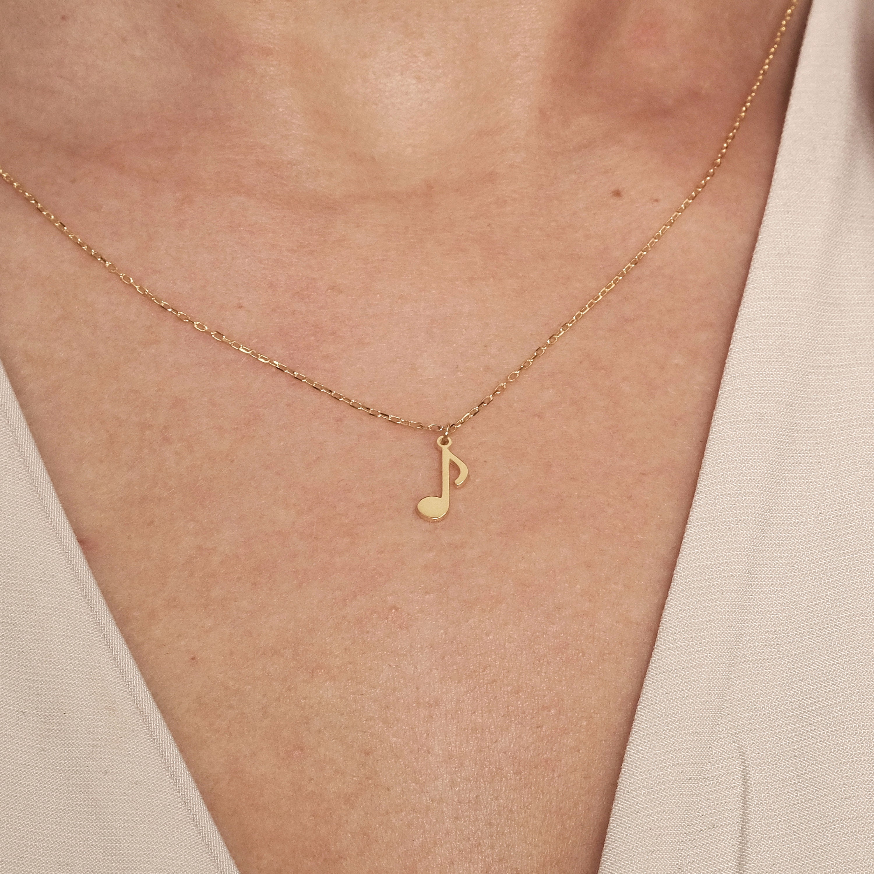 Gold music shop pendant