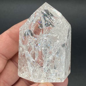 Clear Crackle Quartz Tower with brilliant Rainbow Inclusions. Ethically and Faire Trade Sourced from Brazil. 160 grams. Crystal Healing.