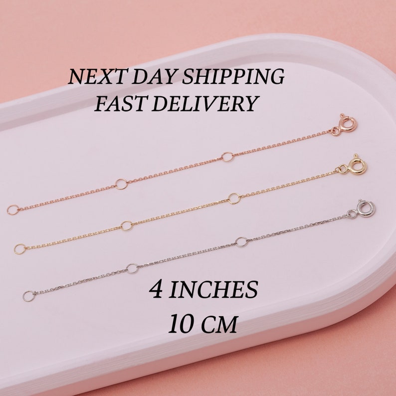 May include: Three necklace extenders in rose gold, gold, and silver, each with a lobster clasp and an adjustable chain. The image includes the text "4 INCHES" and "NEXT DAY SHIPPING FAST DELIVERY".