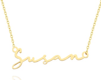 May include: A gold necklace with the name "Susana" written in cursive script.