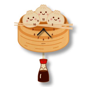 May include: A wooden clock shaped like a bamboo steamer with three cartoon dumplings on top. The clock face has black hands and white numbers. A small bottle of soy sauce with a smiling face hangs from the bottom of the clock.