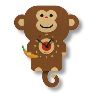 May include: A brown wooden monkey clock with a red clock face and black hands. The monkey is holding a yellow banana and has a swinging tail. The clock face says "popclox".