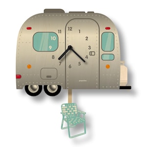 May include: A white ceramic mug with a black handle and the text "But First, Coffee" in a bold, black font. The mug is set against a neutral background, highlighting its simple design.