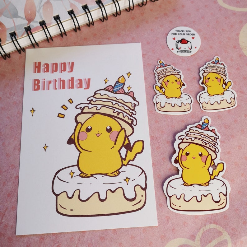 May include: A birthday card with a yellow cartoon character holding a layered cake with a lit candle on top. The card says "Happy Birthday" in pink and white letters. There are three stickers of the same cartoon character holding a cake on a white background.