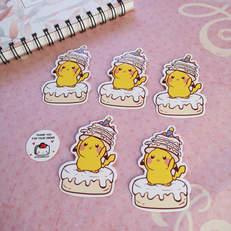 May include: Five yellow cartoon character stickers with a cake on their head. The character is holding the cake with their hands. The stickers are on a pink background.