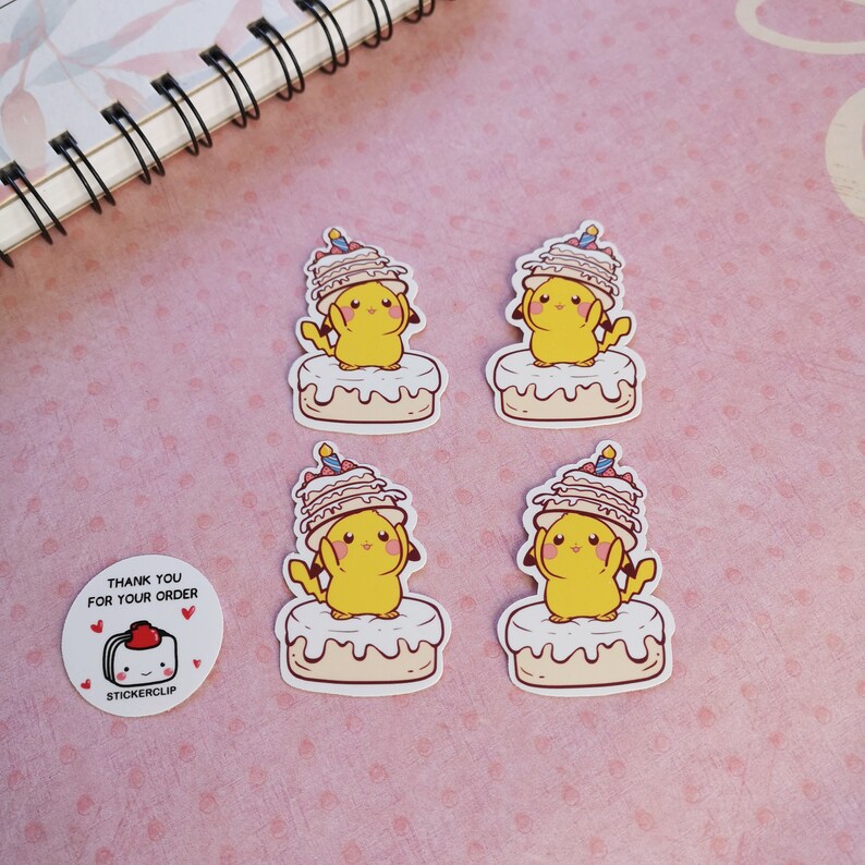 May include: Four stickers featuring a cartoon Pikachu wearing a birthday cake hat. The stickers are on a pink background with white polka dots. The text "Thank you for your order" and a small cartoon cake are visible on one of the stickers.