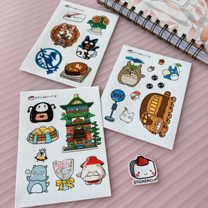 May include: A set of 4 sticker sheets featuring characters from the animated films My Neighbor Totoro and Kiki's Delivery Service. The stickers are printed on white paper with a glossy finish. The sticker sheets are packaged in a clear plastic bag. The sticker sheets are perfect for adding a touch of whimsy to your planner, laptop, or water bottle.