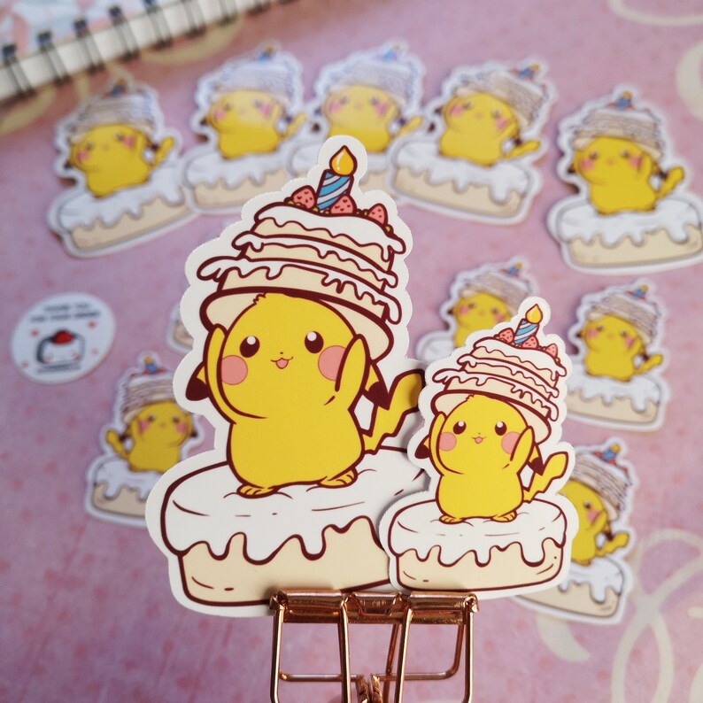 May include: A set of yellow Pikachu cartoon character stickers with a birthday cake theme. The stickers feature Pikachu wearing a cake hat and holding a cake. The stickers are perfect for adding a fun and festive touch to any project.