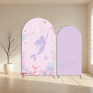 May include: Two arched backdrop covers featuring a light pink theme. The left cover displays a purple mermaid silhouette, the text Vernus 2, and various sea life illustrations. The right cover features a repeating purple mermaid scale pattern.