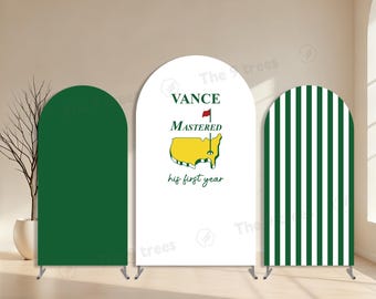 May include: Three arched backdrop displays. One solid green, one white with text and a map graphic, and one with green and white vertical stripes. The white display reads "VANCE MASTERED his first year".