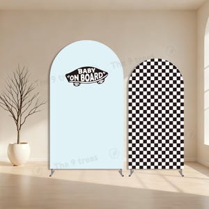 May include: Two arched backdrop stands. One is light blue with the text "BABY ON BOARD" in black. The other has a black and white checkered pattern. Both stands have metal supports at the base. The backdrop stands are for a baby shower or birthday.