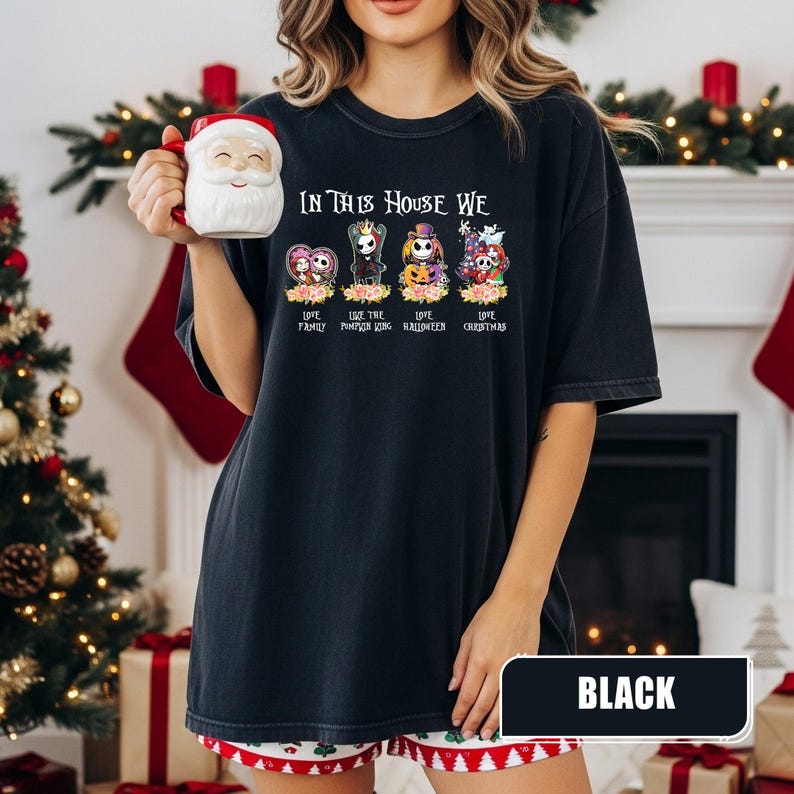 May include: Black t-shirt with the text "IN THIS HOUSE WE" and four character designs. The shirt also says "LOVE FAMILY", "LOVE THE PUMPKIN KING", "LOVE HALLOWEEN", and "LOVE CHRISTMAS". The shirt is labeled "BLACK".